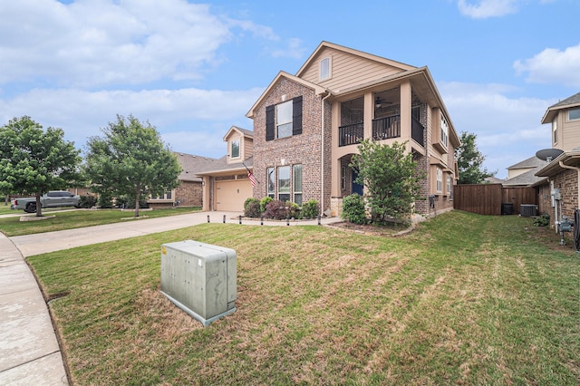 traditional home featuring brick siding, concrete driveway, a balcony, a garage, and central AC unit