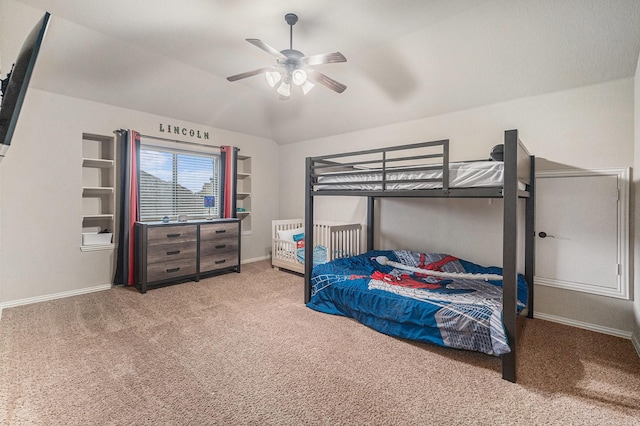 carpeted bedroom with baseboards, a ceiling fan, and vaulted ceiling