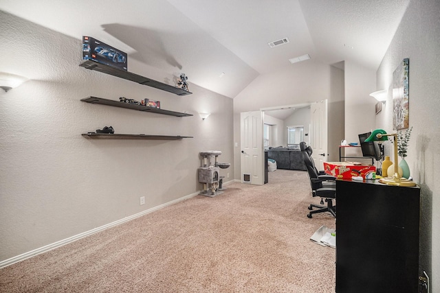 carpeted home office with lofted ceiling and baseboards