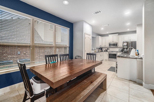 1137 Cardinal Ridge Rd, Burleson, TX 76028 - dining space with light tile patterned flooring, baseboards, and recessed lighting