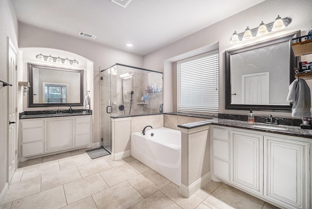 1137 Cardinal Ridge Rd, Burleson, TX 76028 - full bathroom with a shower stall, a garden tub, two vanities, and tile patterned flooring