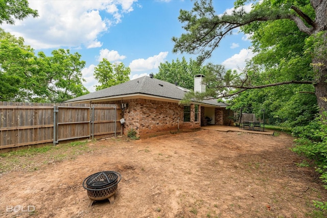 view of yard featuring fence and a patio