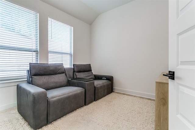 sitting room featuring baseboards, carpet, and vaulted ceiling