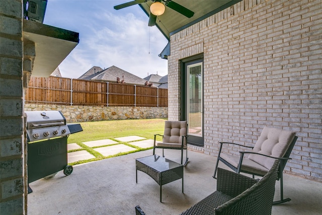 view of patio / terrace featuring a ceiling fan, a fenced backyard, and grilling area