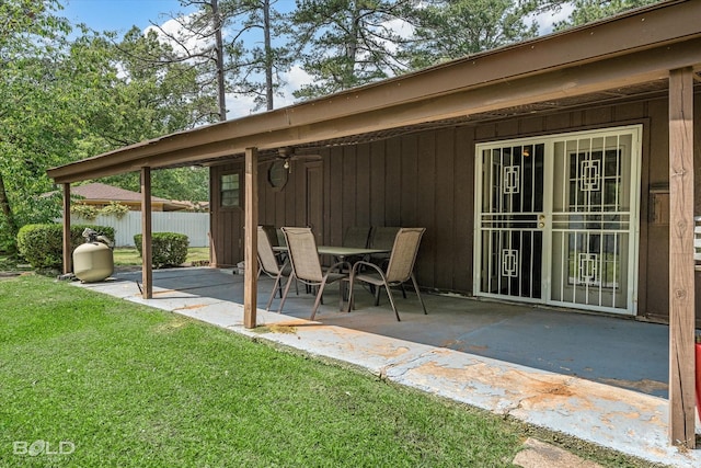 view of patio featuring fence