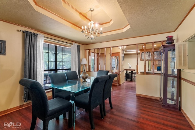 dining space with baseboards, dark wood-style floors, a textured ceiling, and a chandelier