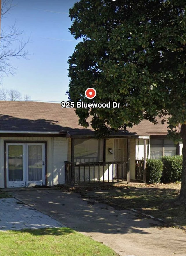 view of front of house featuring roof with shingles