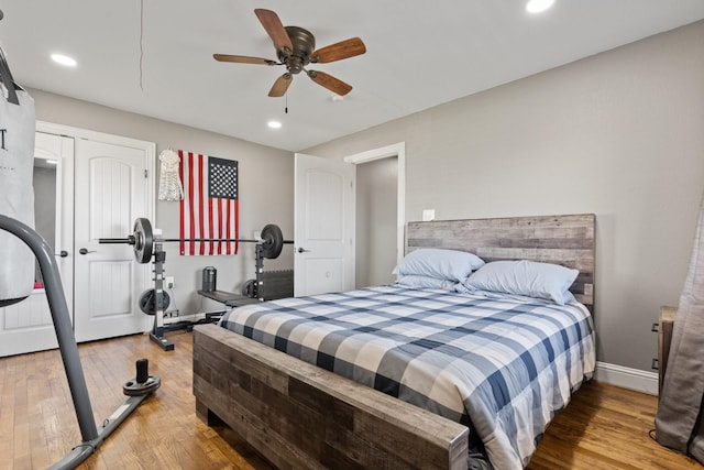 bedroom featuring recessed lighting, baseboards, and wood finished floors