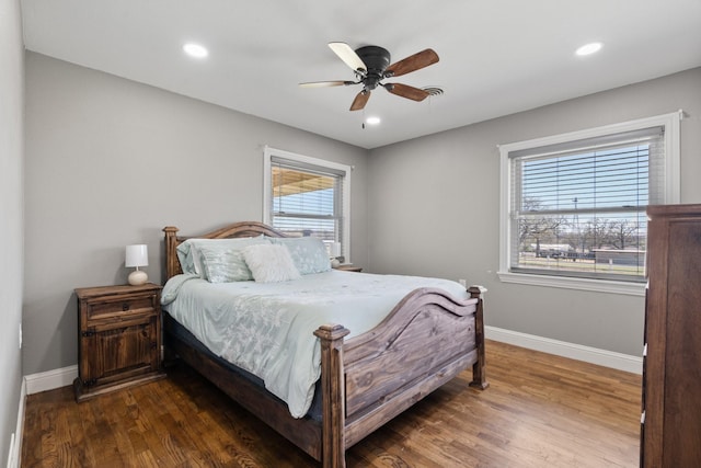 bedroom featuring baseboards, recessed lighting, and dark wood-type flooring