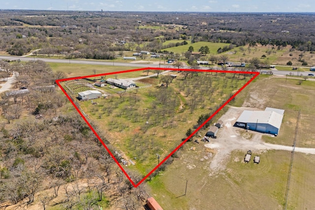birds eye view of property with a rural view