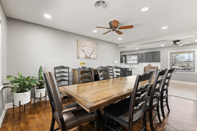 dining area with visible vents, wood finished floors, baseboards, ceiling fan, and recessed lighting