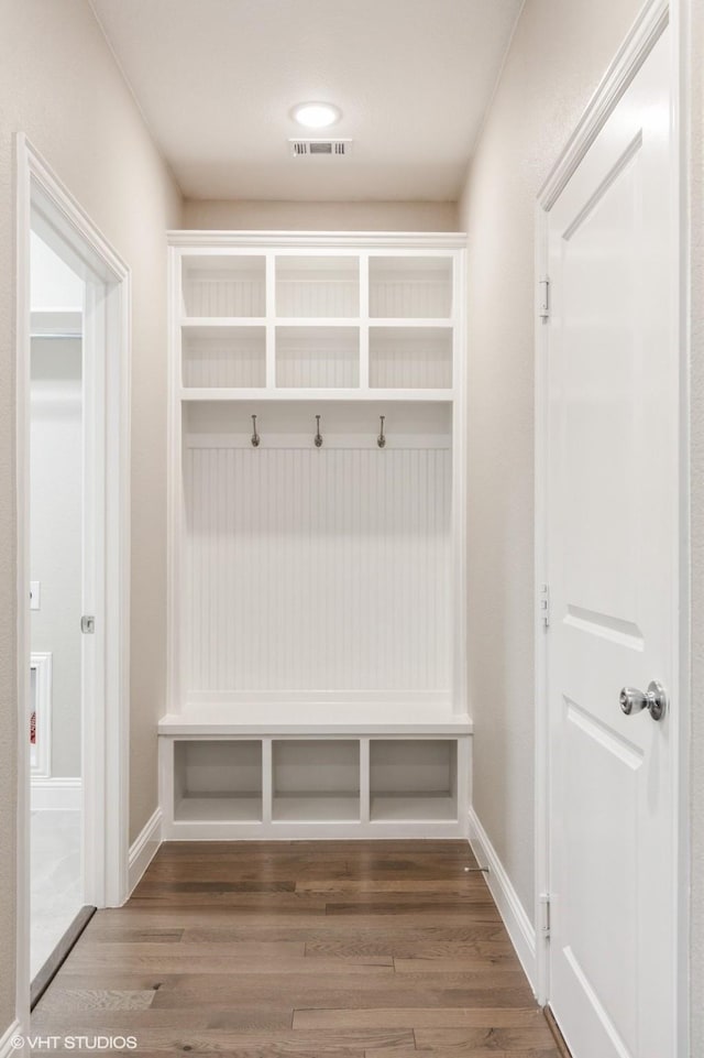 mudroom with visible vents and wood finished floors