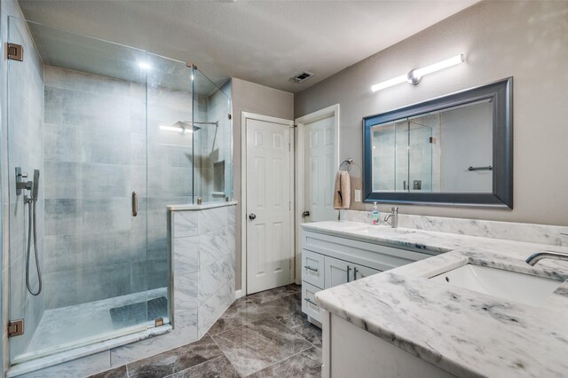 3467 Navajo Cir, Dallas, TX 75224 - full bath with double vanity, a shower stall, and marble finish floors