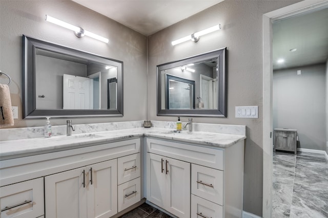 3467 Navajo Cir, Dallas, TX 75224 - bathroom with double vanity and baseboards