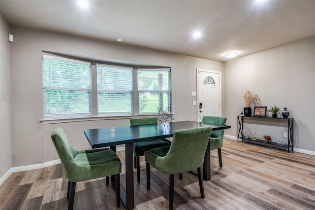 3467 Navajo Cir, Dallas, TX 75224 - dining area featuring light wood-style flooring and baseboards