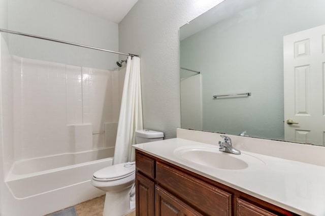 bathroom with shower / bath combo with shower curtain, toilet, and vanity