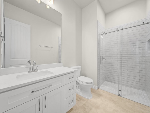 full bath featuring toilet, a shower stall, and vanity