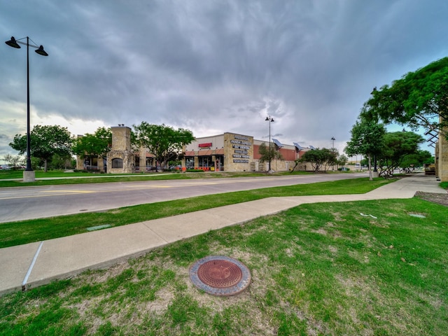 exterior space featuring street lighting and sidewalks