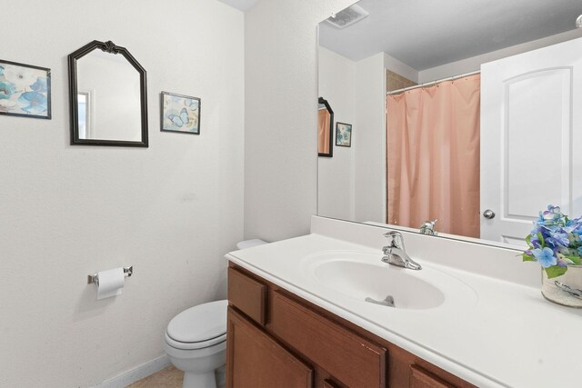 1320 Corkwood Dr, Princeton, TX 75407 - bathroom with vanity, baseboards, toilet, and visible vents