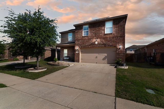 1320 Corkwood Dr, Princeton, TX 75407 - traditional home featuring brick siding, an attached garage, a lawn, and fence