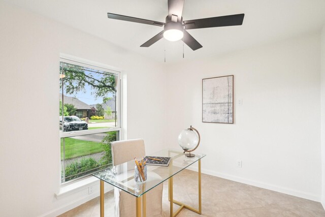 office featuring light tile patterned flooring, baseboards, and ceiling fan