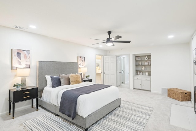 bedroom featuring recessed lighting, baseboards, light colored carpet, and visible vents