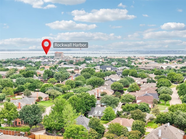 bird's eye view with a residential view and a water view