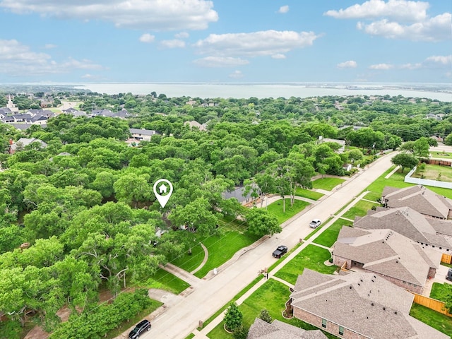 birds eye view of property featuring a water view and a residential view