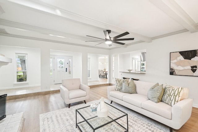 living room with wood finished floors, ceiling fan, beam ceiling, and visible vents