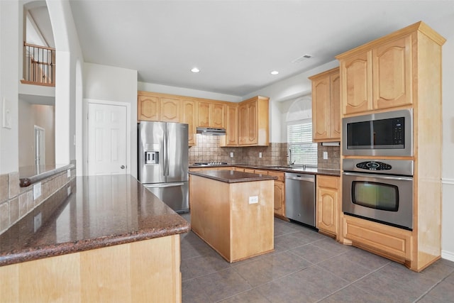 kitchen with visible vents, appliances with stainless steel finishes, and light brown cabinetry