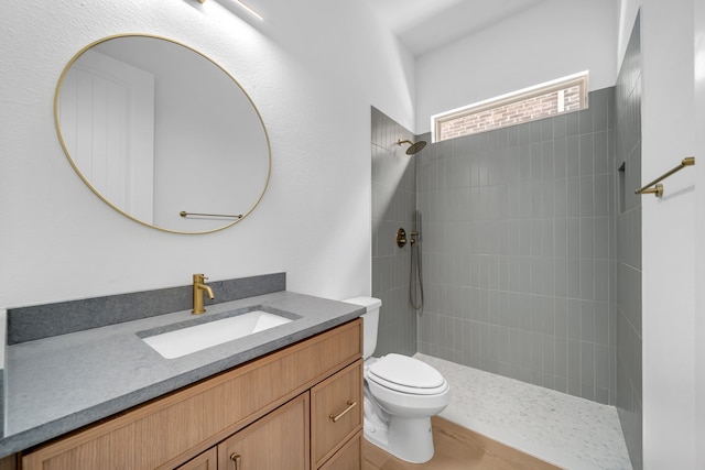 17546 Sequoia Dr, Dallas, TX 75252 - full bathroom featuring vanity, a tile shower, and toilet