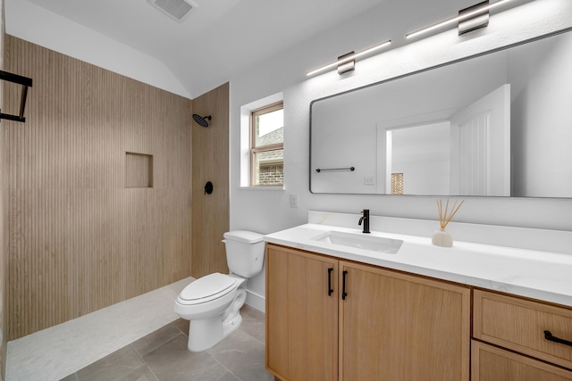 17546 Sequoia Dr, Dallas, TX 75252 - full bath featuring vanity, toilet, vaulted ceiling, visible vents, and tiled shower