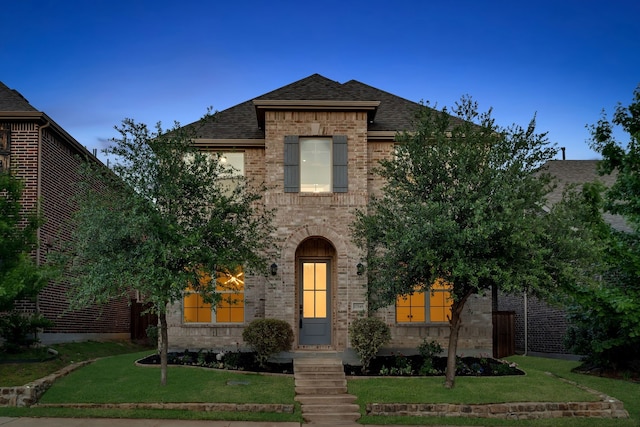 17546 Sequoia Dr, Dallas, TX 75252 - view of front facade with brick siding, roof with shingles, and a front yard