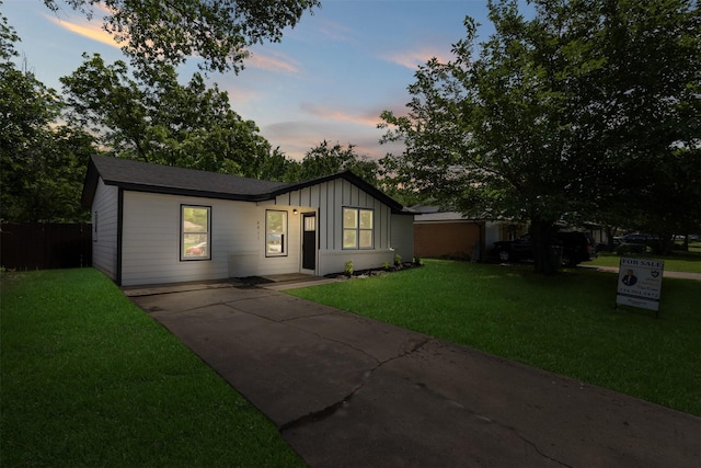 view of front of property with board and batten siding and driveway