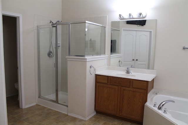 2005 Sumac Dr, Forney, TX 75126 - full bathroom featuring a shower stall, a bath, vanity, and toilet