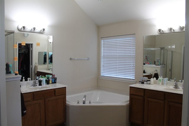 2005 Sumac Dr, Forney, TX 75126 - full bath with a shower stall, a bath, and two vanities