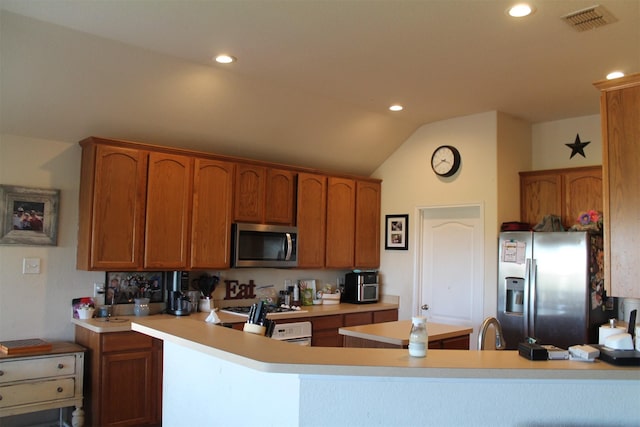 2005 Sumac Dr, Forney, TX 75126 - kitchen with stainless steel appliances, a peninsula, vaulted ceiling, light countertops, and recessed lighting