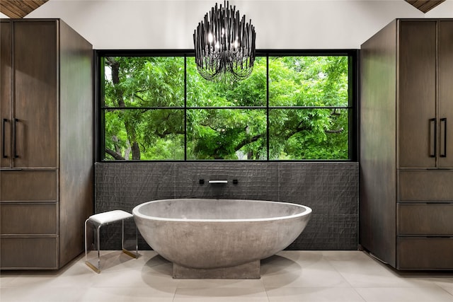 4280 Shorecrest Dr, Dallas, TX 75209 - full bathroom featuring a freestanding bath, a chandelier, and tile patterned floors