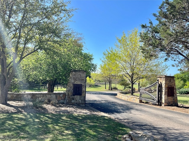 view of gate with fence