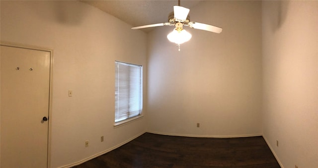 unfurnished room with baseboards, ceiling fan, and wood finished floors