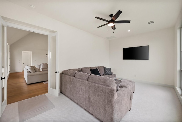 carpeted living area with a ceiling fan, french doors, recessed lighting, and visible vents