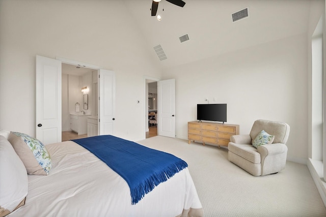 bedroom with visible vents, carpet, and high vaulted ceiling
