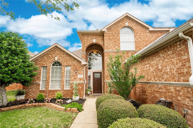 view of front of property featuring brick siding