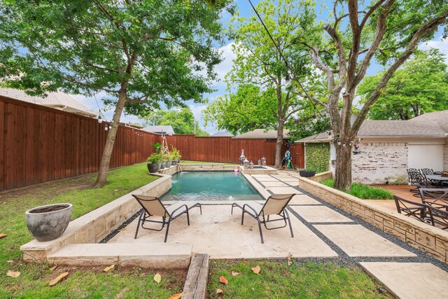 view of swimming pool with a fenced backyard, a fenced in pool, and a patio