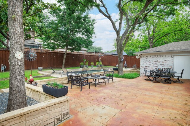 view of patio / terrace featuring outdoor dining area and a fenced backyard