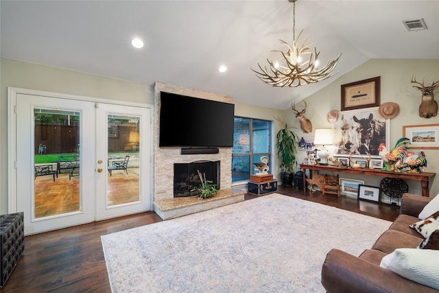 11330 Hillcrest Rd, Dallas, TX 75230 - living room with visible vents, a chandelier, vaulted ceiling, a fireplace, and dark wood-style floors