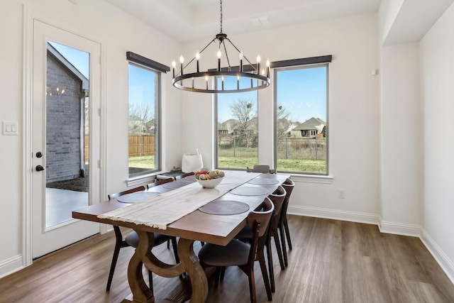 311 Misty Ln, Argyle, TX 76226 - dining room with baseboards, an inviting chandelier, and wood finished floors