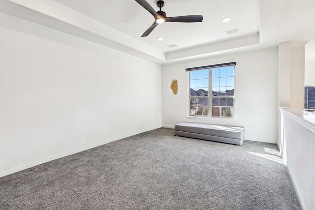 311 Misty Ln, Argyle, TX 76226 - empty room with carpet floors, a ceiling fan, a tray ceiling, and visible vents