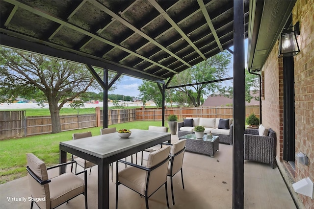 view of patio / terrace featuring outdoor dining area, a fenced backyard, and an outdoor hangout area