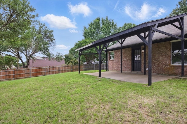view of yard featuring fence and a patio